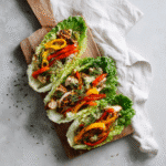 Chicken & Veggie Lettuce Wraps on wooden table