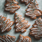 stack of soft gingerbread cookies with maple glaze on white plate